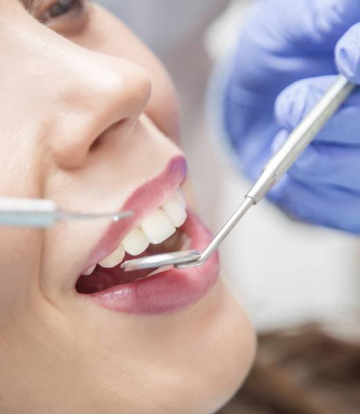 Close up view of open mouth during oral checkup at the dentist